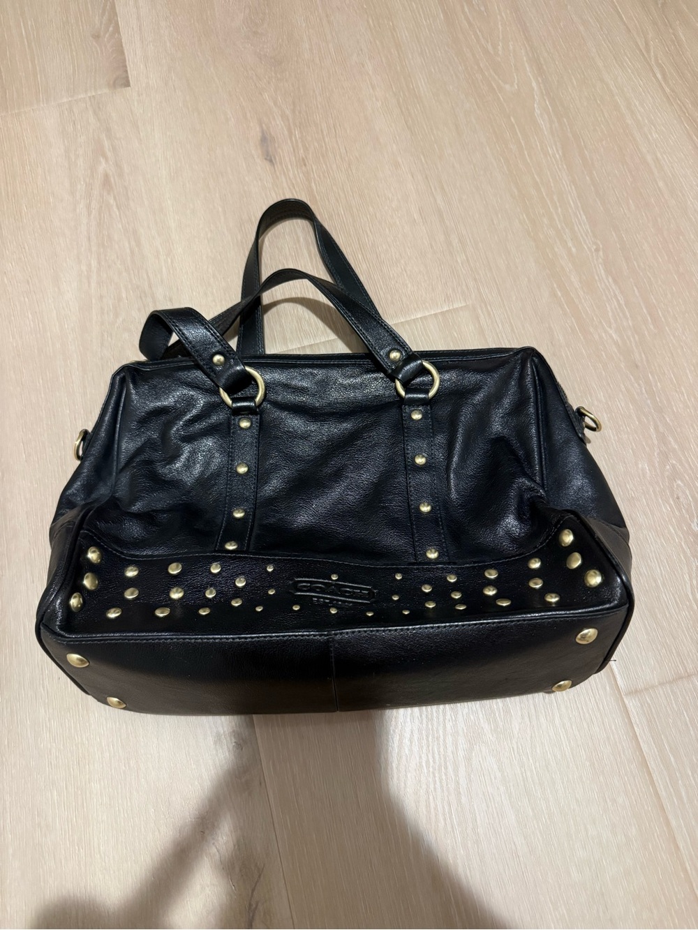 Black Coach leather bag with gold studs